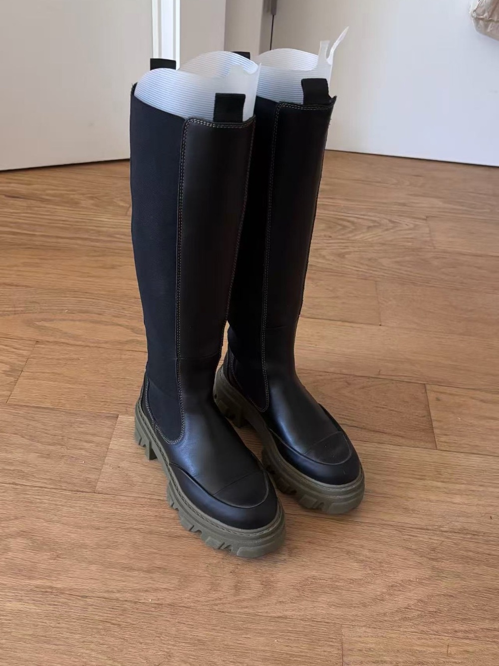 Ganni tall leather Chelsea boot with chunky green sole